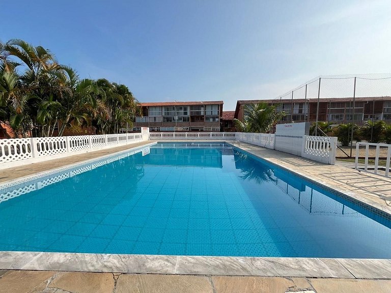 Apt em cond. Piscina, vaga e Wi-Fi, 5min da praia